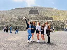 Travelers in front of the Pyramid of the Sun
